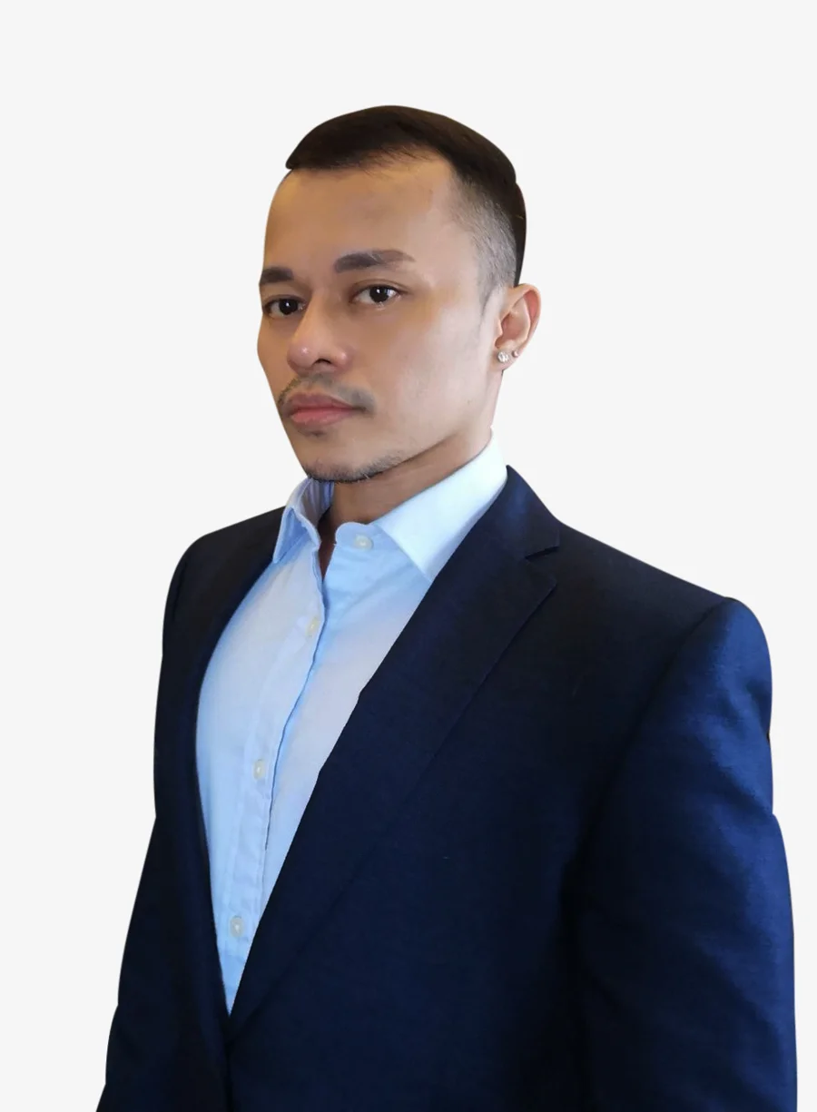 Yong Caballero in a navy blazer and light-blue shirt